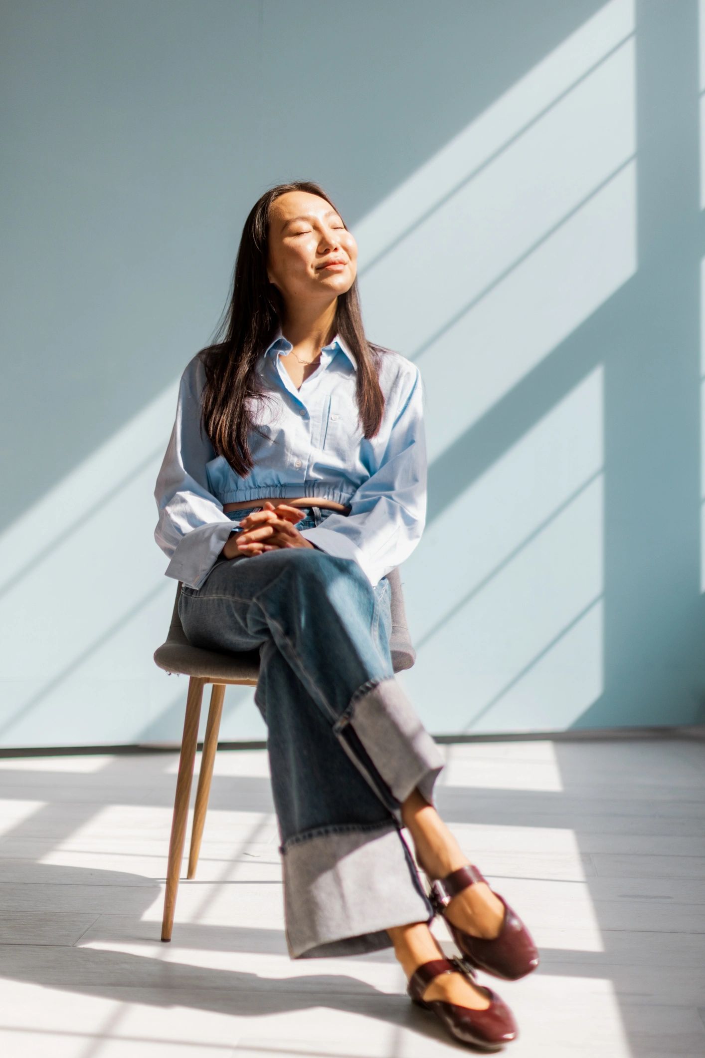 Lexi Collins, Clinical Hypnotherapist, seated in a calm professional setting